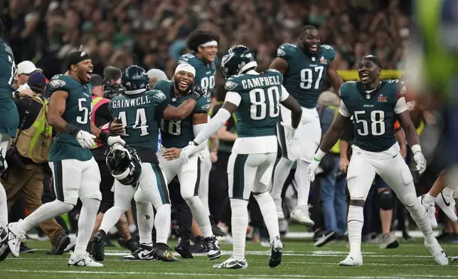 Member of the Philadelphia Eagles celebrate after defeating the Kansas City Chiefs during the NFL Super Bowl 59 football game, Sunday, Feb. 9, 2025, in New Orleans. (AP Photo/Abbie Parr)