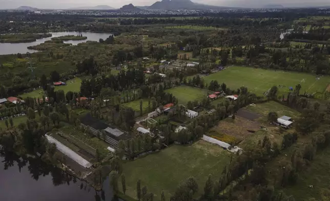 FILE - Ancestral floating gardens are visible next to new soccer fields on Xochimilco Lake in Mexico City, Oct. 20, 2024. (AP Photo/Felix Marquez, File)