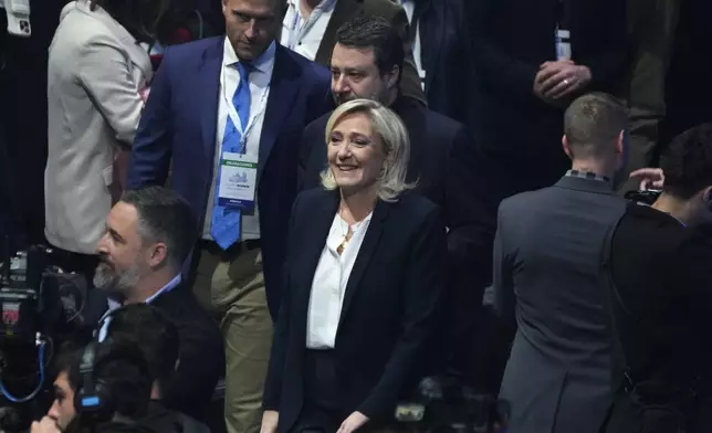 French far-right leader Marine Le Pen, centre, arrives with far-right VOX party leader Santiago Abascal, left and Italy's vice Premier Matteo Salvini, centre top at the Patriots for Europe summit in Madrid, Spain, Saturday, Feb. 8, 2025. AP Photo/Paul White)