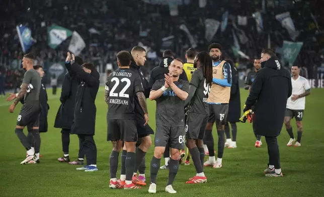 Napoli's Stanislav Lobotka, front, applauds to fans at the end of a Serie A soccer match between Lazio and Napoli in Rome, Italy, Saturday, Feb. 15, 2025. (AP Photo/Andrew Medichini)