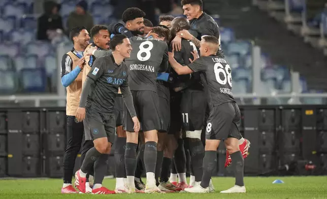 Napoli's players celebrate after Lazio's Adam Marusic scored an own goal during a Serie A soccer match between Lazio and Napoli in Rome, Italy, Saturday, Feb. 15, 2025. (AP Photo/Andrew Medichini)