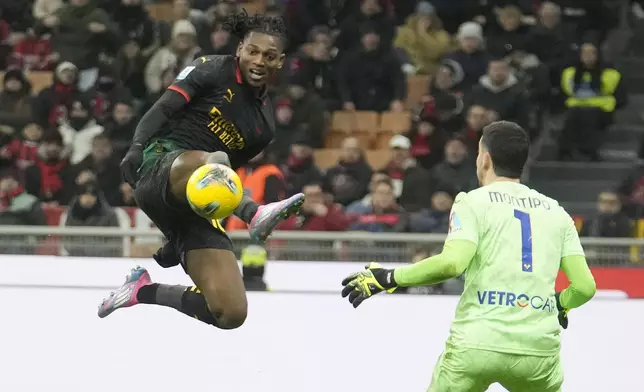 AC Milan's Rafael Leao crosses the ball from which AC Milan's Santiago Gimenez scores the opening goal during the Italian Serie A soccer match between AC Milan and Hellas Verona, at the San Siro Stadium in Milan, Italy, Saturday, Feb.15, 2025. (AP Photo/Luca Bruno)