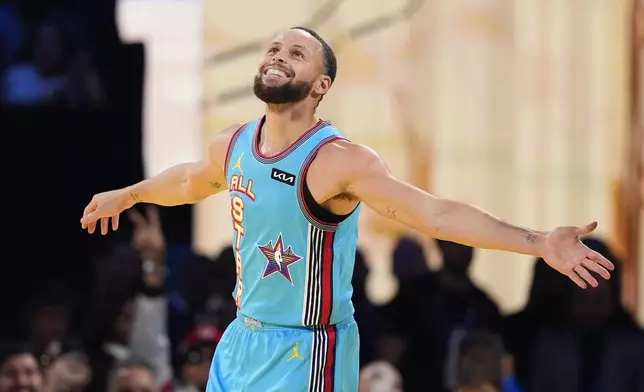Golden State Warriors guard Stephen Curry celebrates after scoring during the NBA All-Star basketball game Sunday, Feb. 16, 2025, in San Francisco. (AP Photo/Godofredo A. Vásquez)