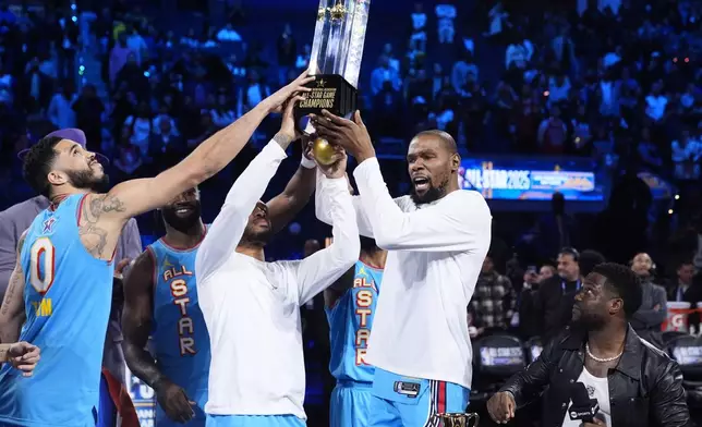 Members of Shaq's OGs hold the winners' trophy after the NBA All-Star basketball game Sunday, Feb. 16, 2025, in San Francisco. (AP Photo/Godofredo A. Vásquez)