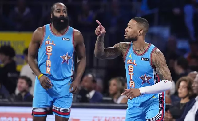 Milwaukee Bucks guard Damian Lillard, right, gestures next to Los Angeles Clipper guard James Harden during the NBA All-Star basketball game Sunday, Feb. 16, 2025, in San Francisco. (AP Photo/Godofredo A. Vásquez)