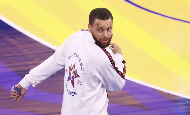 Golden State Warriors guard Stephen Curry warms up before the NBA All-Star basketball game Sunday, Feb. 16, 2025, in San Francisco. (AP Photo/Jed Jacobsohn)