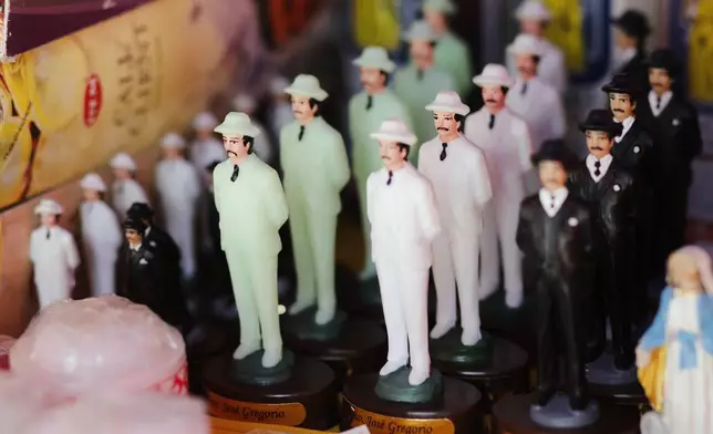 Figurines depicting physician Jose Gregorio Hernandez are displayed for sale at a church in Caracas, Venezuela, Tuesday, Feb. 25, 2025, after Pope Francis approved the canonization of the physician known as the "doctor of the poor", making him Venezuela's first saint. (AP Photo/Cristian Hernandez)