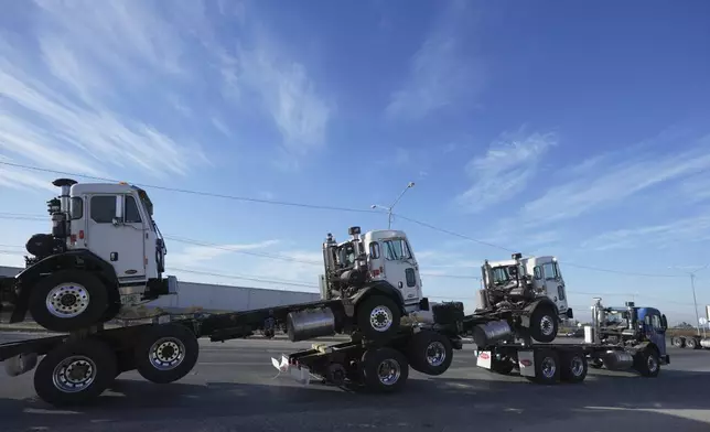 A truck pulls newly assembled truck cabs across the border bridge, from Mexico into the United States, from Mexicali, Mexico, Monday, Feb. 3, 2025. (AP Photo/Fernando Llano)