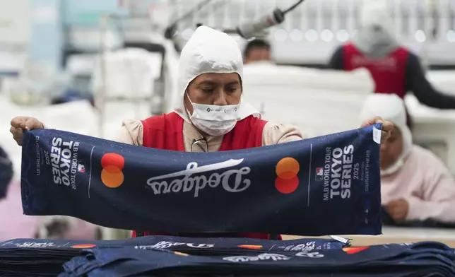 An employee works at a textile factory in Tlaxcala, Mexico, Tuesday, Feb. 4, 2025. (AP Photo/Eduardo Verdugo)