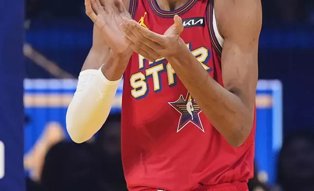 San Antonio Spurs center Victor Wembanyama applauds on the court during the NBA All-Star basketball game Sunday, Feb. 16, 2025, in San Francisco. (AP Photo/Godofredo A. Vásquez)