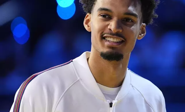 San Antonio Spurs center Victor Wembanyama smiles before the NBA All-Star basketball game Sunday, Feb. 16, 2025, in San Francisco. (AP Photo/Godofredo A. Vásquez)