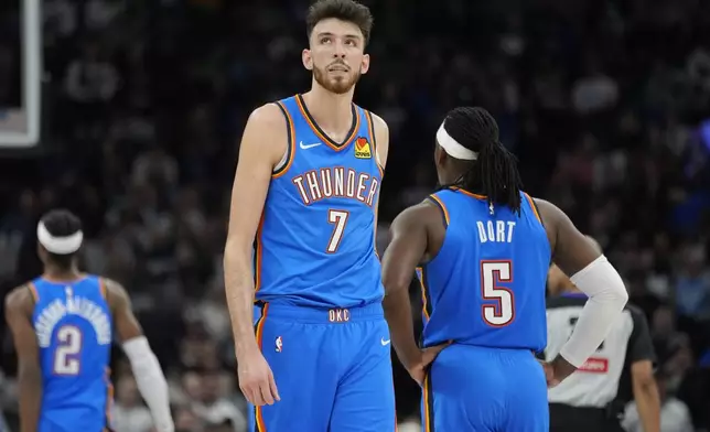 Oklahoma City Thunder forward Chet Holmgren (7) walks across the court during the first half of an NBA basketball game against the Minnesota Timberwolves, Thursday, Feb. 13, 2025, in Minneapolis. (AP Photo/Abbie Parr)