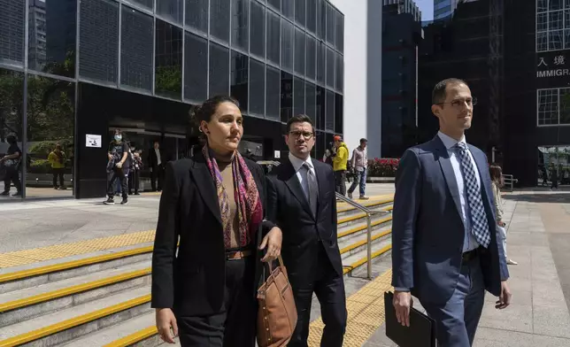Representatives from the U.S. and Canada consulates leave the District Court ahead of the sentencing on a riot case involving a former pro-democracy lawmaker Lam Cheuk-ting in Wan Chai, Hong Kong on Thursday, Feb. 27, 2025. (AP Photo/Chan Long Hei)