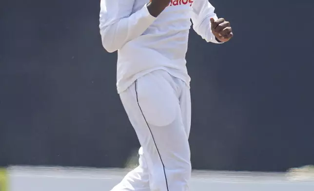Sri Lanka's Nishan Peiris celebrates the wicket of Australia's Travis Head during day two of the second test cricket match between Sri Lanka and Australia in Galle , Sri Lanka, Friday, Feb. 7, 2025. (AP Photo/Eranga Jayawardena)