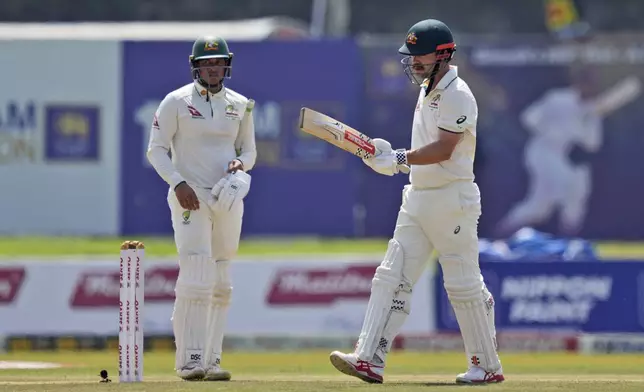 Australia's Travis Head leaves the ground after losing his wicket during day two of the second test cricket match between Sri Lanka and Australia in Galle , Sri Lanka, Friday, Feb. 7, 2025. (AP Photo/Eranga Jayawardena)