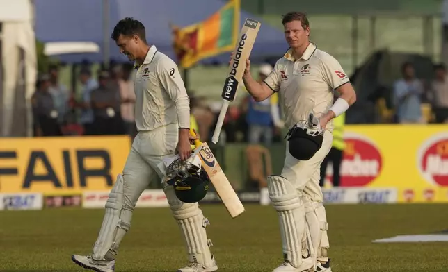 Australia's Steven Smith and Alex Carey leave the ground at the end of day two of the second test cricket match between Sri Lanka and Australia in Galle , Sri Lanka, Friday, Feb. 7, 2025. (AP Photo/Eranga Jayawardena)