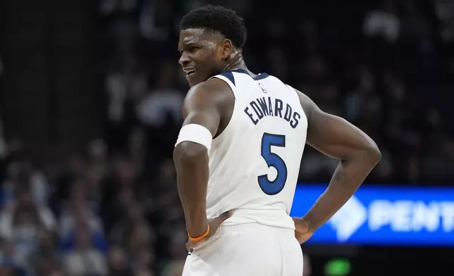 Minnesota Timberwolves guard Anthony Edwards (5) reacts after a foul called on his team during the first half of an NBA basketball game against the Sacramento Kings, Monday, Feb. 3, 2025, in Minneapolis. (AP Photo/Abbie Parr)