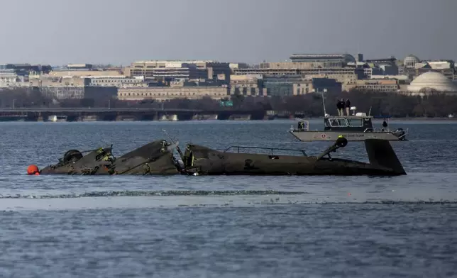 In this image provided by the U.S. Coast Guard, wreckage is seen in the Potomac River near Ronald Reagan Washington National Airport, Thursday, Jan. 30, 2025 in Washington. (Petty Officer 2nd Class Taylor Bacon, U.S. Coast Guard via AP)
