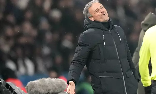 PSG's head coach Luis Enrique grimaces during the French League One soccer match between Paris Saint-Germain and Monaco at Parc des Princes stadium in Paris, Friday, Feb. 7, 2025. (AP Photo/Michel Euler)