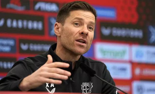 Leverkusen's head coach Xabi Alonso speaks to the media during a press conference ahead of the Bundesliga soccer match between Bayer Leverkusen and Bayern Munich in Leverkusen, Germany, Friday, Feb. 14, 2025. (AP Photo/Martin Meissner)