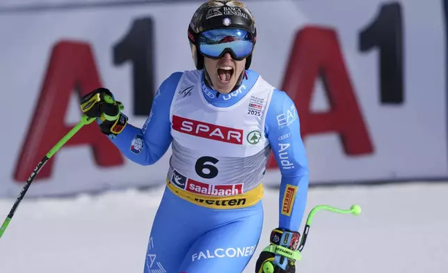 Italy's Federica Brignone celebrates at the finish area of a women's Super-G, at the Alpine Ski World Championships, in Saalbach-Hinterglemm, Austria, Thursday, Feb. 6, 2025. (AP Photo/Giovanni Auletta)