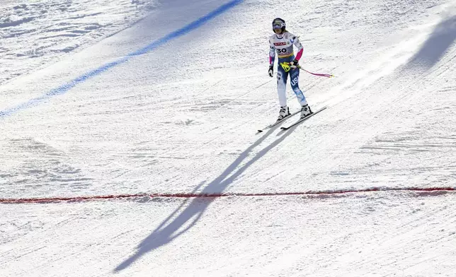 United States' Lindsey Vonn arrives at the finish area after crashing during a women's Super-G, at the Alpine Ski World Championships, in Saalbach-Hinterglemm, Austria, Thursday, Feb. 6, 2025. (Jean-Christophe Bott/Keystone via AP)