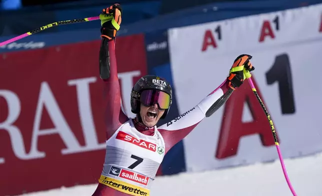 Austria's Stephanie Venier celebrates at the finish area of a women's Super-G, at the Alpine Ski World Championships, in Saalbach-Hinterglemm, Austria, Thursday, Feb. 6, 2025. (AP Photo/Giovanni Auletta)