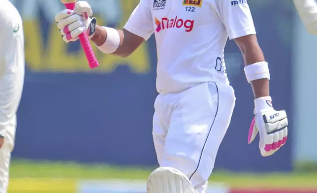 Sri Lanka's Dinesh Chandimal celebrates his fifty runs during the first day of the second test cricket match between Sri Lanka and Australia in Galle, Sri Lanka, Thursday, Feb. 6, 2025. (AP Photo/Lahiru Harshana)