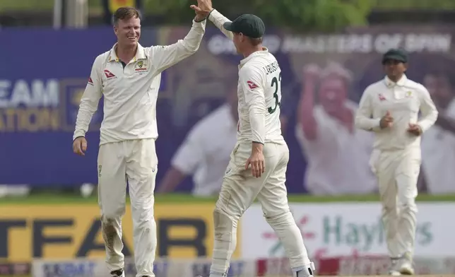 Australia's Matthew Kuhnemann celebrates the wicket of Jeffrey Vandersay during day four of the first test cricket match between Sri Lanka and Australia in Galle , Sri Lanka, Saturday, Feb. 1, 2025. (AP Photo/Eranga Jayawardena)