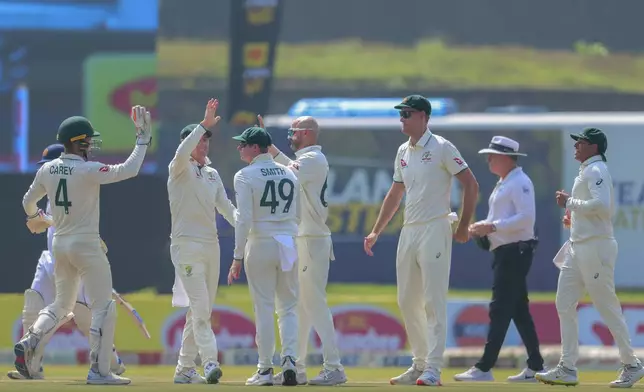 Australia's Nathan Lyon, centre, celebrates the wicket Sri Lanka's Pathum Nissanka with his team mates during the second test cricket match between Sri Lanka and Australia in Galle , Sri Lanka, Thursday, Feb. 6, 2025. (AP Photo/Lahiru Harshana)