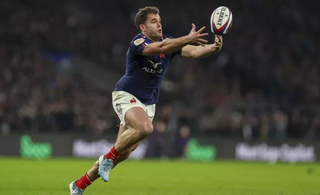 France's Damian Penaud drops the ball during the Six Nations rugby union match between England and France at Twickenham in London, Saturday, Feb. 8, 2025. (AP Photo/Ian Walton)