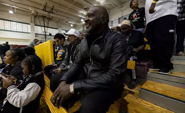 Pastor Charles Johnson attends an event at the gymnasium of Pasadena City College during which The Change Reaction will be handing out about 1,000 checks of between $2,500-$5,000 to people impacted by the Eaton Fire, Tuesday, Jan. 28, 2025 in Pasadena, Calif. (AP Photo/Etienne Laurent)