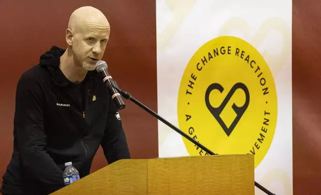GoFundMe CEO Tim Cadogan delivers a speech as he attends an event at the gymnasium of Pasadena City College where The Change Reaction will be handing out about 1,000 checks of between $2,500-$5,000, Tuesday, Jan. 28, 2025 in Pasadena, Calif. (AP Photo/Etienne Laurent)
