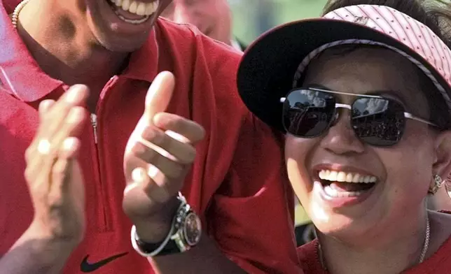 FILE - Tiger Woods enjoys a laugh with his mother, Kultida, after winning the Western Open at Cog Hill Golf &amp; Country Club in Lemont, Ill., Sunday, July 6, 1997. (AP Photo/Frank Polich, File)