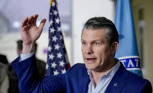 US Secretary of Defense Pete Hegseth talks to the media during his visit to the headquarters of U.S. European Command and Africa Command at the Africa Command at Kelly Barracks in Stuttgart Germany, Tuesday, Feb. 11, 2025. (AP Photo/Michael Probst)