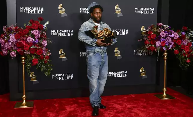 Kendrick Lamar poses in the press room with the award for record of the year, best rap performance, best rap song, best music video and song of the year during the 67th annual Grammy Awards on Sunday, Feb. 2, 2025, in Los Angeles. (Photo by Richard Shotwell/Invision/AP)