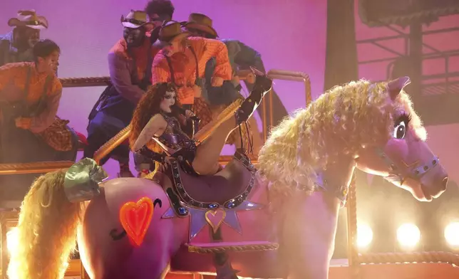 Chappell Roan, center, performs "Pink Pony Club" during the 67th annual Grammy Awards on Sunday, Feb. 2, 2025, in Los Angeles. (AP Photo/Chris Pizzello)