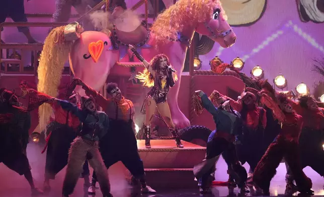 Chappell Roan, center, performs "Pink Pony Club" during the 67th annual Grammy Awards on Sunday, Feb. 2, 2025, in Los Angeles. (AP Photo/Chris Pizzello)