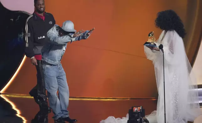 Diana Ross, right, presents the award for song of the year for "Not Like Us" to Kendrick Lamar during the 67th annual Grammy Awards on Sunday, Feb. 2, 2025, in Los Angeles. (AP Photo/Chris Pizzello)