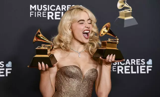 Sabrina Carpenter poses in the press room with the award for best pop solo performance, and best pop vocal album during the 67th annual Grammy Awards on Sunday, Feb. 2, 2025, in Los Angeles. (Photo by Richard Shotwell/Invision/AP)