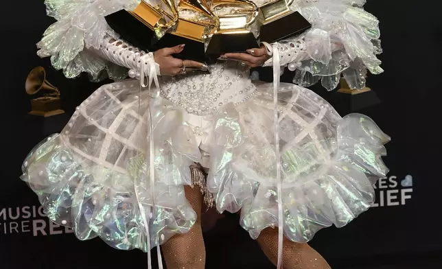 Sierra Ferrell poses in the press room with her awards for best American roots performance, best American roots song, best Americana performance and best Americana album during the 67th annual Grammy Awards on Sunday, Feb. 2, 2025, in Los Angeles. (Photo by Richard Shotwell/Invision/AP)