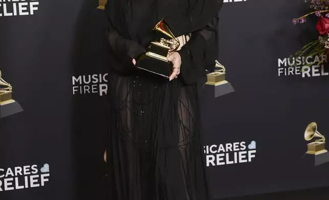Charli XCX poses in the press room with the award for best pop dance recording for "Von dutch, during the 67th annual Grammy Awards on Sunday, Feb. 2, 2025, in Los Angeles. (Photo by Richard Shotwell/Invision/AP)