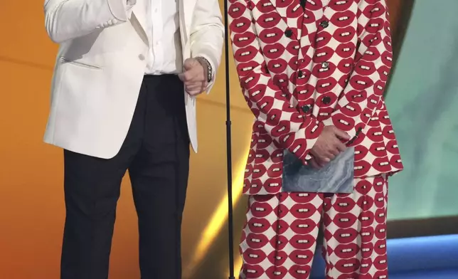 Chad Smith, left, and Anthony Kiedis of Red Hot Chili Peppers presents the award for best pop vocal album during the 67th annual Grammy Awards on Sunday, Feb. 2, 2025, in Los Angeles. (AP Photo/Chris Pizzello)