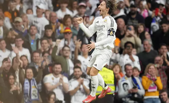 Real Madrid's Luka Modric celebrates after scoring the opening goal during the Spanish La Liga soccer match between Real Madrid and Girona at the Santiago Bernabeu stadium in Madrid, Spain, Sunday, Feb. 23, 2025. (AP Photo/Manu Fernandez)