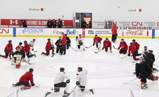 Canada players practice for the 4 Nations Face-Off hockey tournament in Brossard, Que., on Monday, Feb. 10, 2025. Canada will face Sweden on Feb. 12. (Christinne Muschi/The Canadian Press via AP)