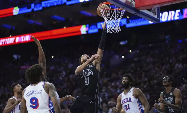 Brooklyn Nets' Trendon Watford (9) goes up for a shot during the first half of an NBA basketball game against the Philadelphia 76ers, Saturday, Feb. 22, 2025, in Philadelphia. (AP Photo/Matt Slocum)