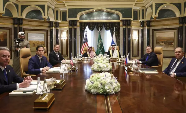 U.S. Secretary of State Marco Rubio, second left, meets with Saudi Foreign Minister Prince Faisal bin Farhan Al Saud, Saudi National Security Advisor Mosaad bin Mohammad Al-Aiban, U.S. National Security Advisor Mike Waltz, third left, U.S. Middle East envoy Steve Witkoff, left, Russian Foreign Minister Sergei Lavrov, right, and Russian President Vladimir Putin's foreign policy advisor Yuri Ushakov, second right, at Diriyah Palace, in Riyadh, Saudi Arabia, Tuesday Feb. 18, 2025. (Evelyn Hockstein/Pool Photo via AP)