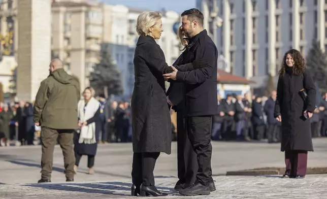 In this photo provided by the Ukrainian Presidential Press Office, Office Ukraine's President Volodymyr Zelensky, right, greeting European Commission President Ursula von der Leyen during a ceremony in Kyiv, Ukraine, Monday, Feb. 24, 2025. (Ukrainian Presidential Press Office via AP)