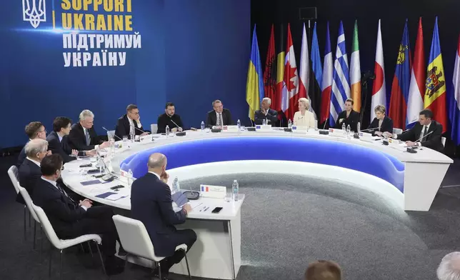 From second left by the table's sits: Sweden's Prime Minister Ulf Kristersson, Norway's Prime Minister Jonas Gahr Stoere, Estonia's Prime Minister Kristen Michal, Canada's Prime Minister Justin Trudeau, Lithuania's President Gitanas Nauseda, Finland's President Alexander Stubb, Ukrainian President Volodymyr Zelenskiy, Latvia's President Edgars Rinkevics, European Council President Antonio Costa, European Commission President Ursula von der Leyen, Denmark's Prime Minister Mette Frederiksen, Iceland's Prime Minister Kristrun Frostadottir, Spain's Prime Minister Pedro Sanchez attend a press conference after the "Support Ukraine" summit, marking the third anniversary of the Russian invasion, in Kyiv, Ukraine, Feb. 24, 2025. (Gleb Garanich/Pool Photo via AP)