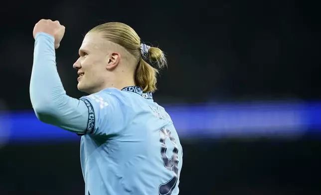 Manchester City's Erling Haaland celebrates after scoring his sides first goal during the Champions League playoff first leg soccer match between Manchester City and Real Madrid at the Etihad Stadium in Manchester, England, Tuesday, Feb. 11, 2025. (AP Photo/Dave Thompson)